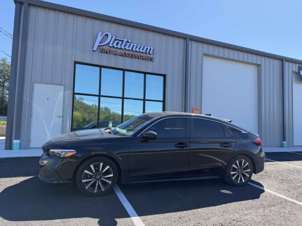 Dark gray Honda Accord parked outside Platinum Tint & Accessories.